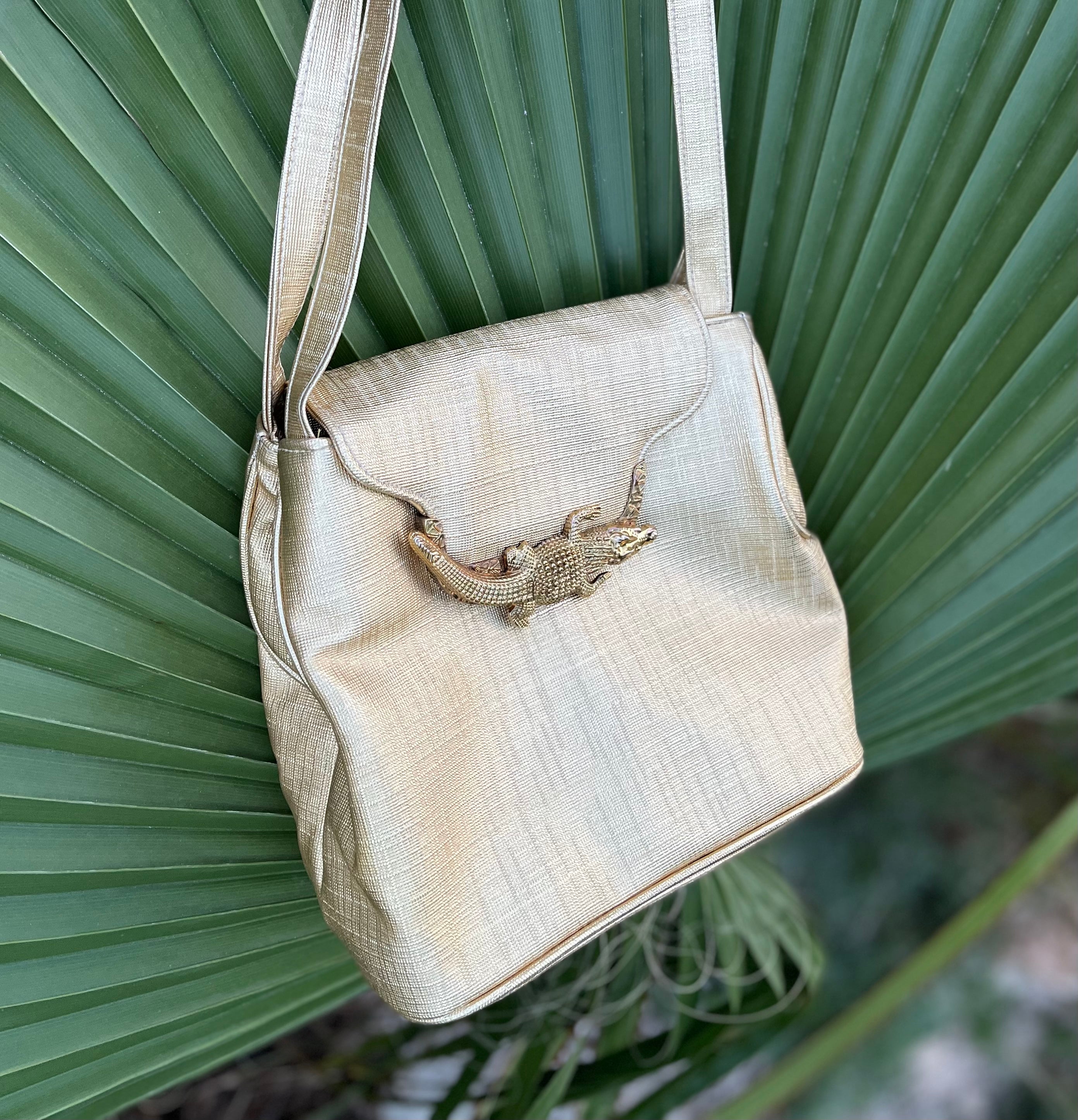 Gold shoulder bag with gold crocodile clasp. From a Vintage Clothing Store based in Harrogate